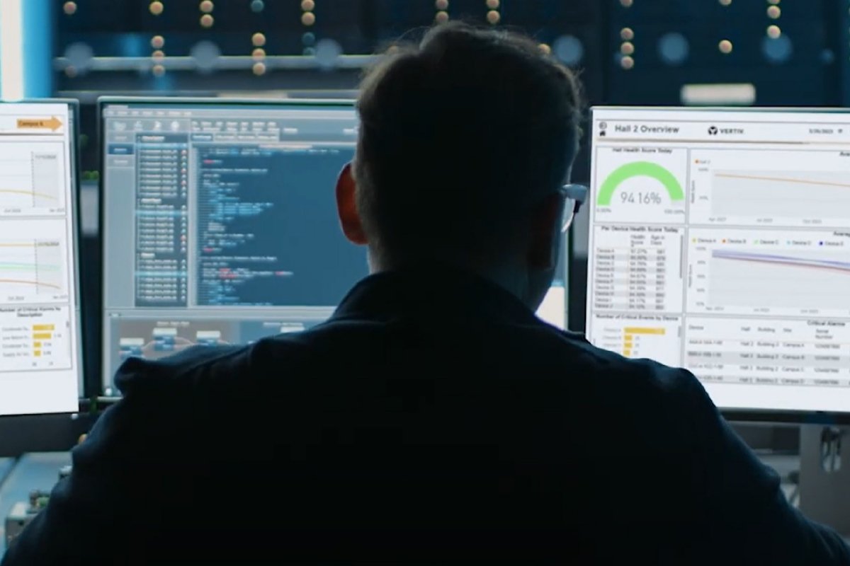 Hands typing on a laptop keyboard to manage AI software as a service infrastructure.